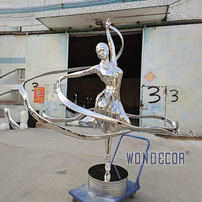 Large stainless steel character shaped outdoor sculpture in the park