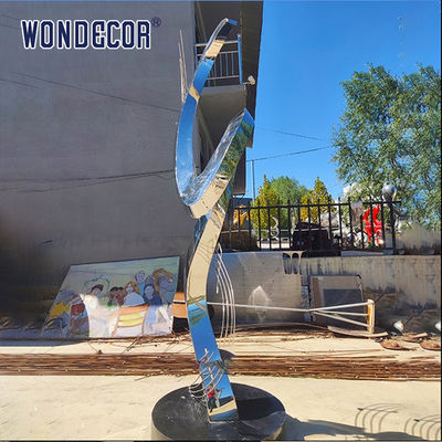 Large rotating stainless steel sculpture outdoor square park